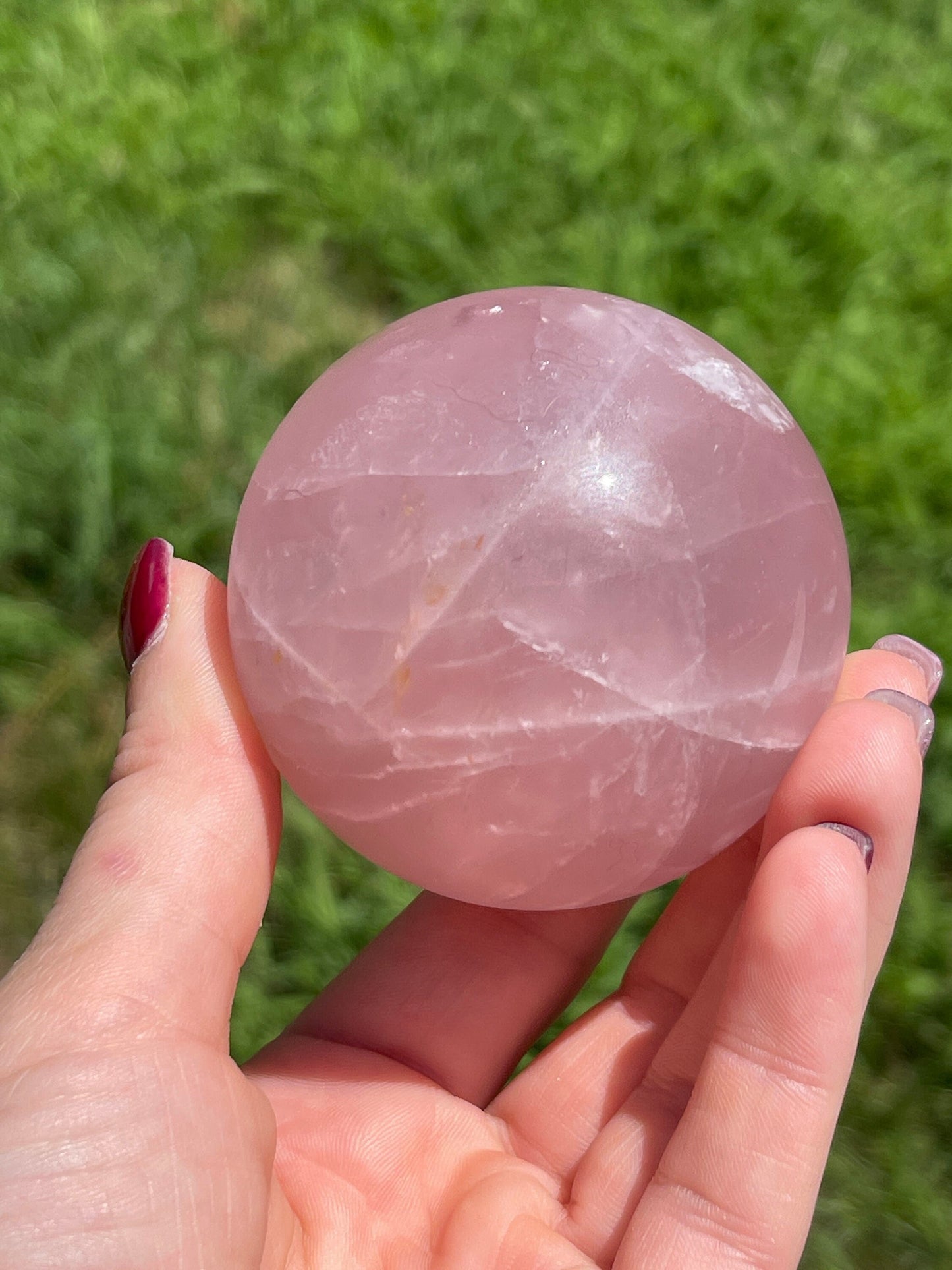 Rose quartz sphere with rainbow