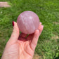 Rose quartz sphere with rainbow