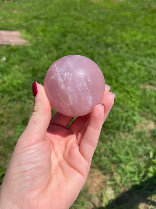 Rose quartz sphere with rainbow
