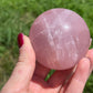 Rose quartz sphere with rainbow
