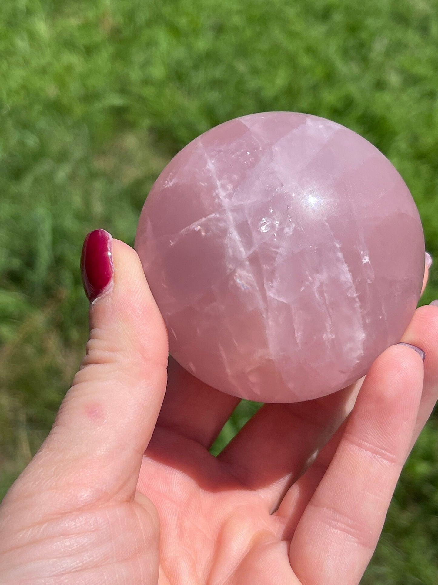 Rose quartz sphere with rainbow