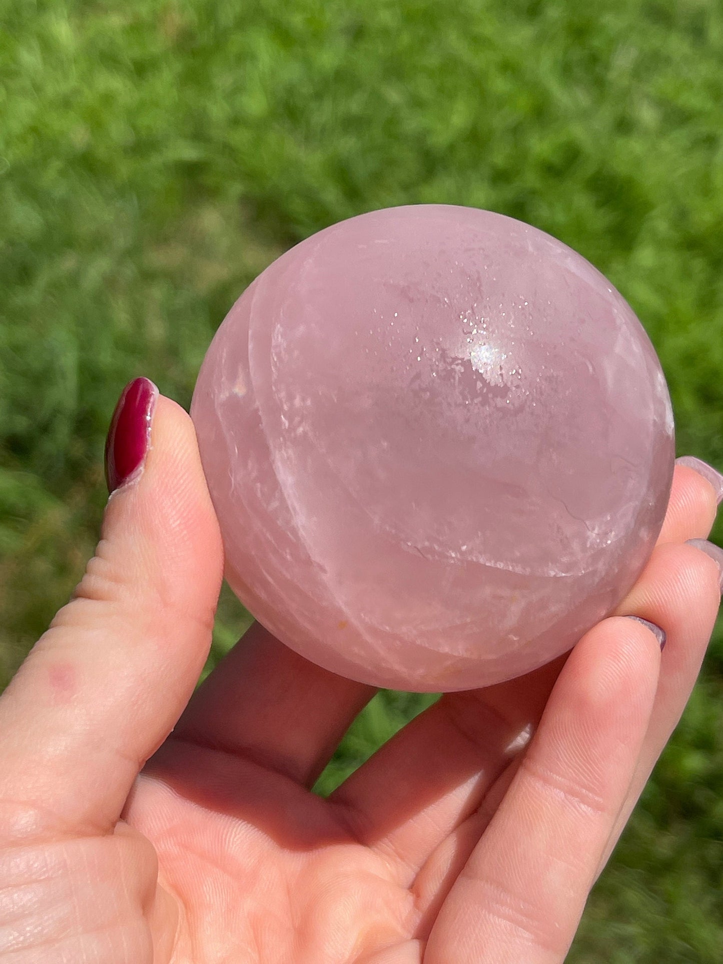 Rose quartz sphere with rainbow