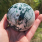 Moss agate sphere with druzy