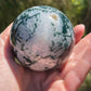 Moss agate sphere with druzy
