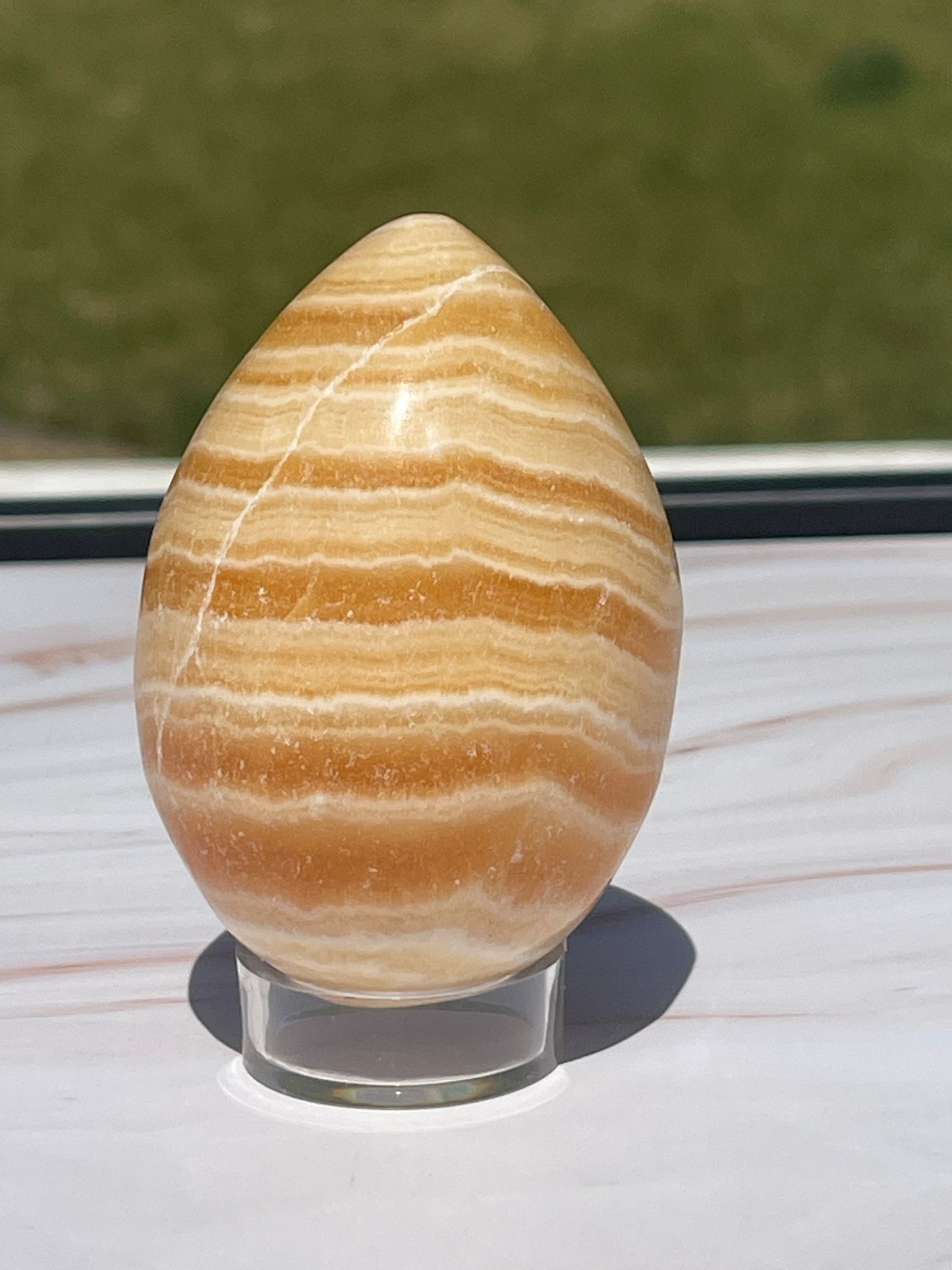 Orange calcite Crystal Egg Carving