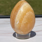 Orange calcite crystal egg carving