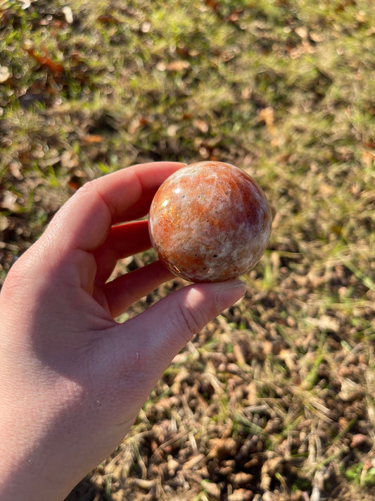 Sunstone with moonstone crystal sphere