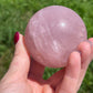 Rose quartz sphere with rainbow
