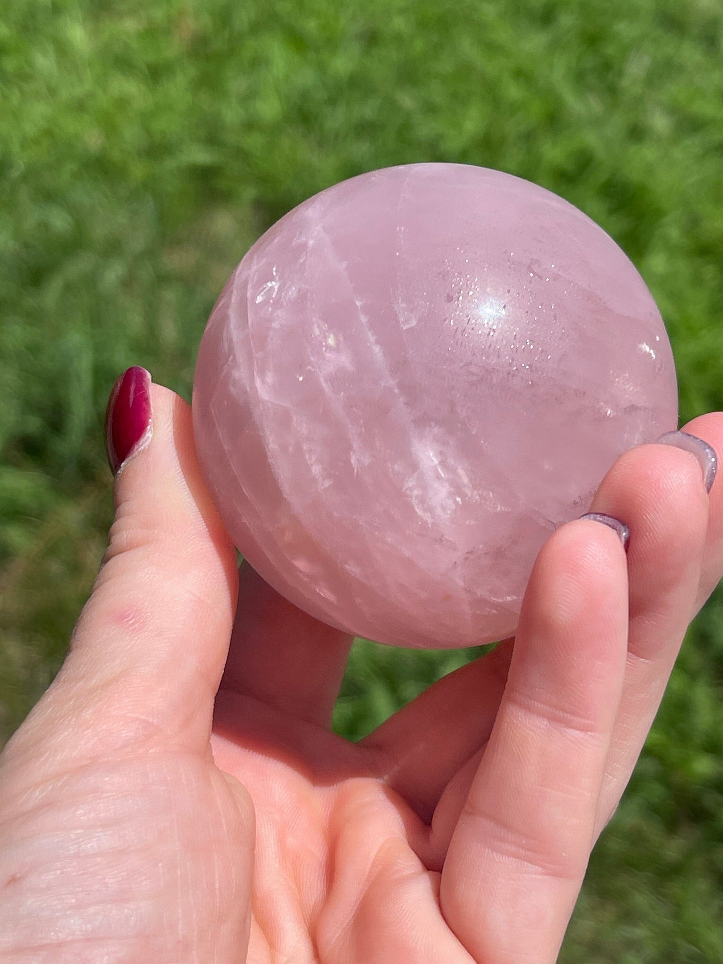 Rose quartz sphere with rainbow
