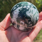 Moss agate sphere with druzy