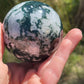Moss agate sphere with druzy