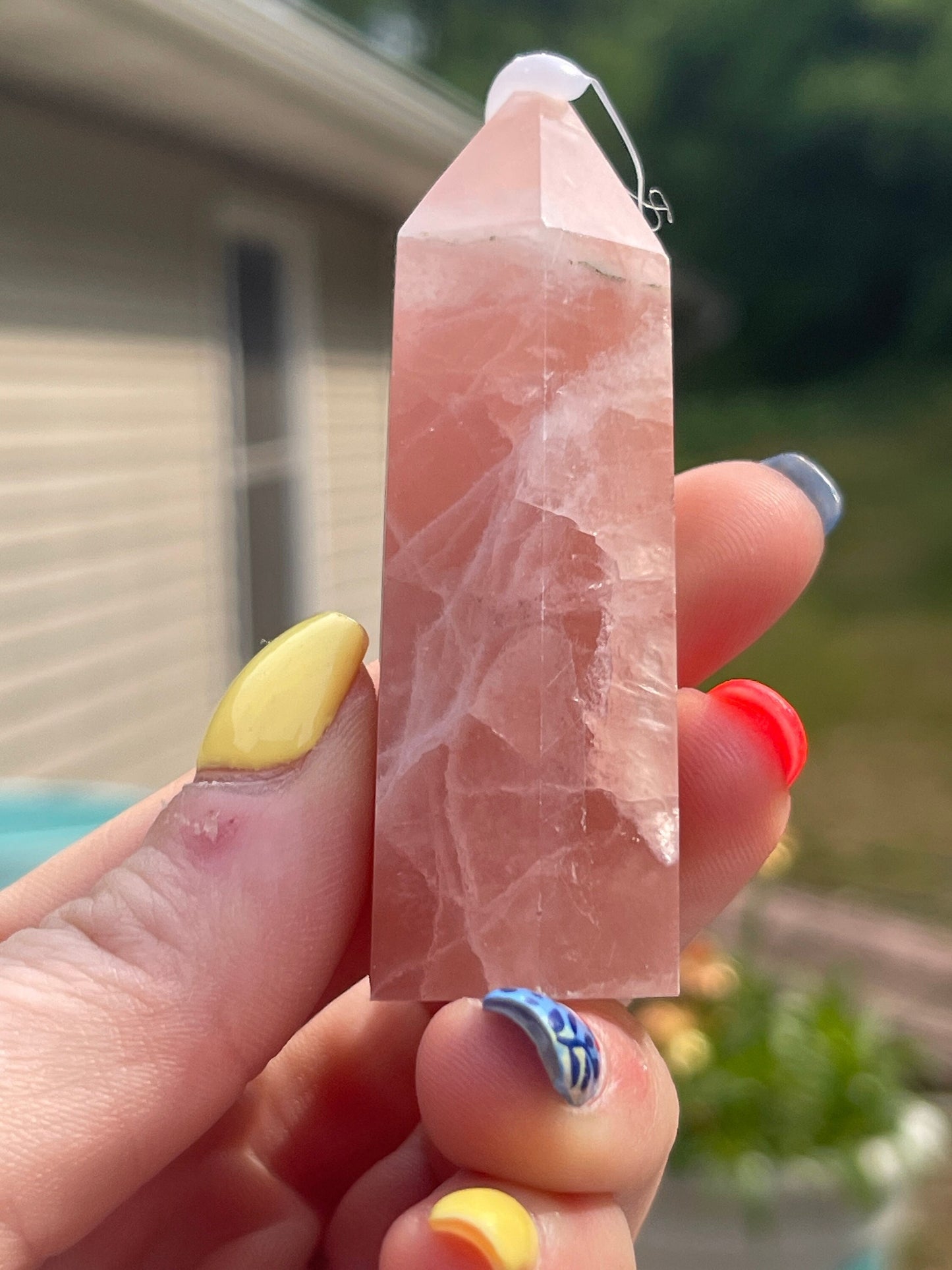 Natural rose calcite tower