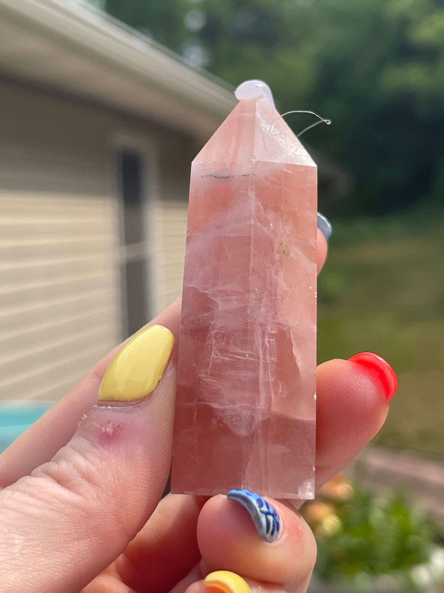 Natural rose calcite tower