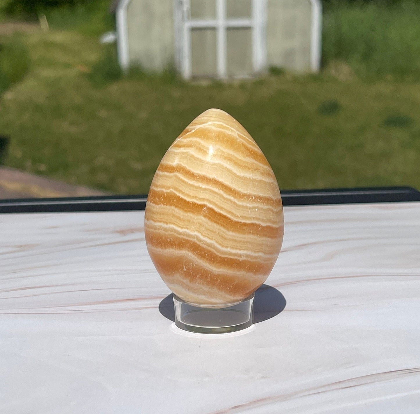 Orange calcite Crystal Egg Carving