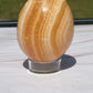 Orange calcite crystal egg carving
