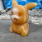 Orange calcite pikachu carving